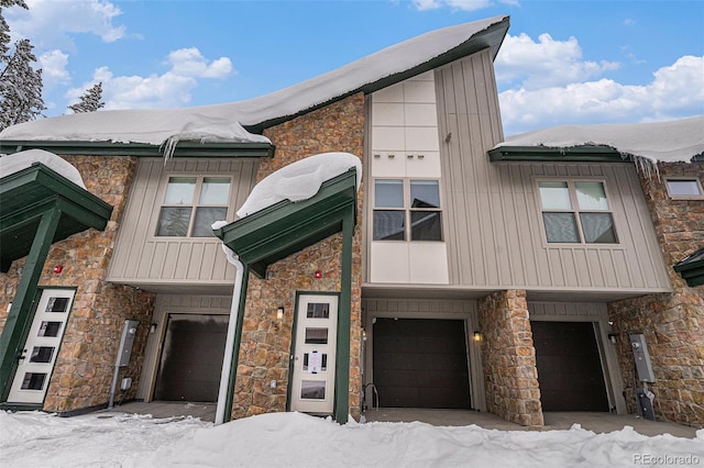 view of front of property with board and batten siding and an attached garage