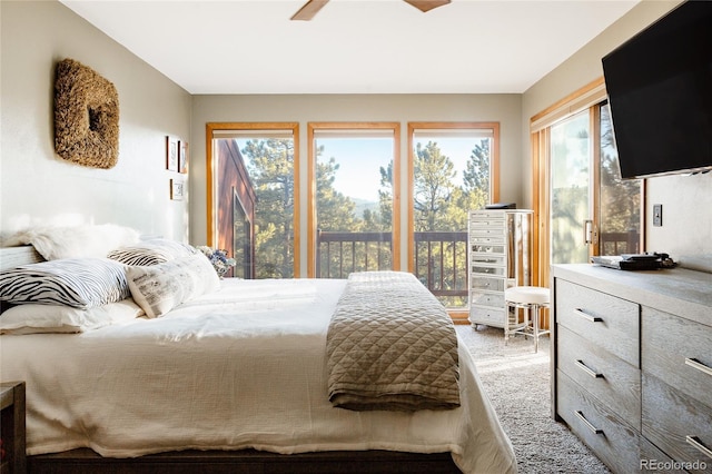 carpeted bedroom with access to outside and ceiling fan