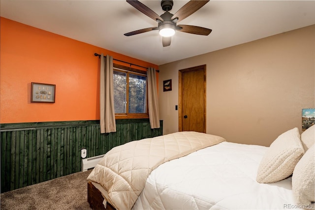 bedroom featuring carpet floors, ceiling fan, and baseboard heating