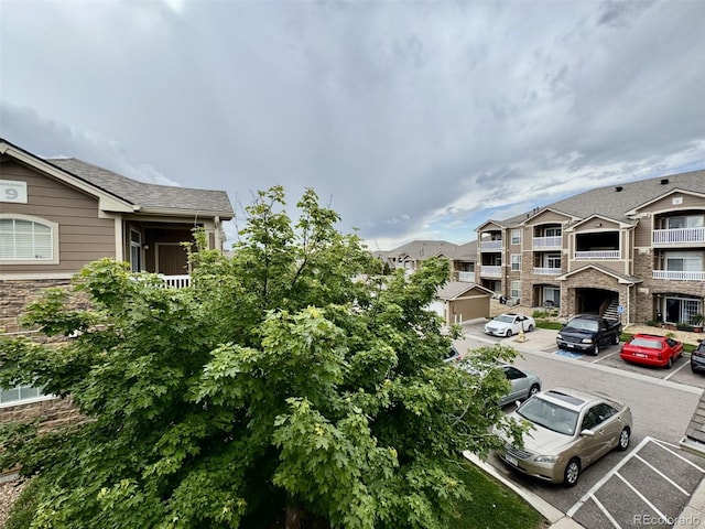 7440 S Blackhawk St Unit 208, Englewood, CO 80112 - view of building exterior with uncovered parking