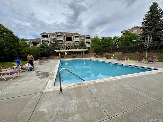 7440 S Blackhawk St Unit 208, Englewood, CO 80112 - community pool featuring a patio area