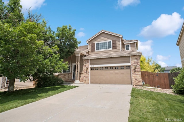 2446 S Gibralter Way, Aurora, CO 80013 - traditional-style home with an attached garage, driveway, and brick siding
