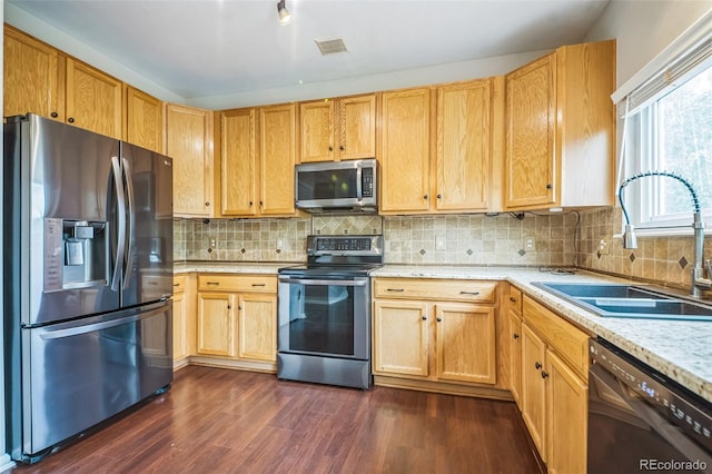 2446 S Gibralter Way, Aurora, CO 80013 - kitchen with stainless steel appliances, dark wood-type flooring, and decorative backsplash