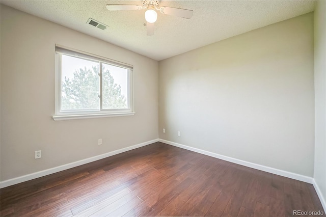 2446 S Gibralter Way, Aurora, CO 80013 - unfurnished room with dark wood-style floors, a textured ceiling, and a ceiling fan
