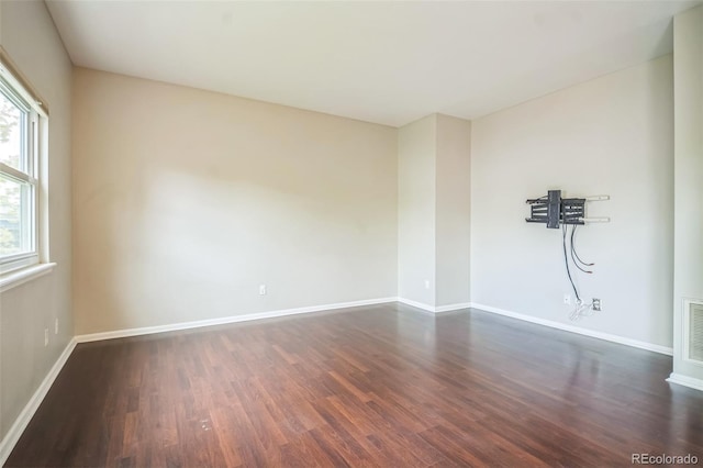 2446 S Gibralter Way, Aurora, CO 80013 - unfurnished room featuring dark wood-style floors