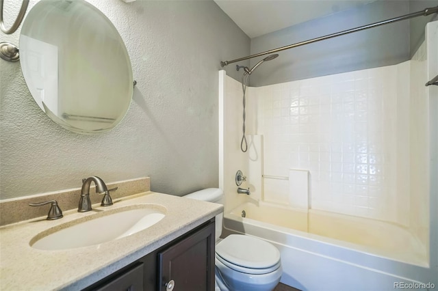 2446 S Gibralter Way, Aurora, CO 80013 - bathroom featuring a textured wall, shower / washtub combination, and vanity