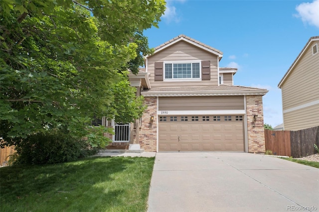 2446 S Gibralter Way, Aurora, CO 80013 - traditional home with brick siding, concrete driveway, an attached garage, and a tile roof