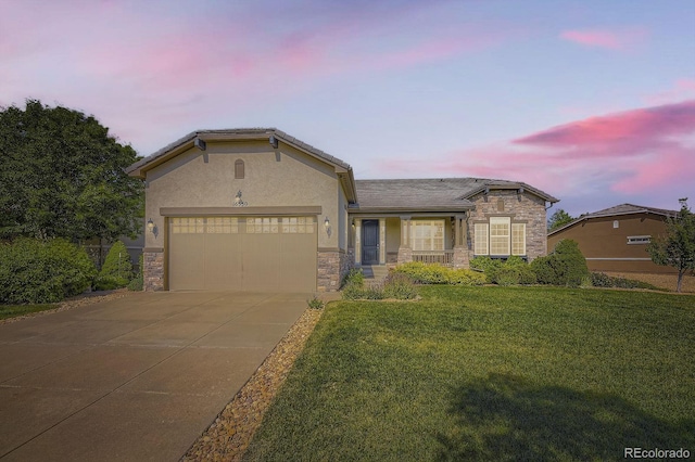16550 Antero Cir, Broomfield, CO 80023 - view of front of house featuring stone siding, a front yard, concrete driveway, and an attached garage