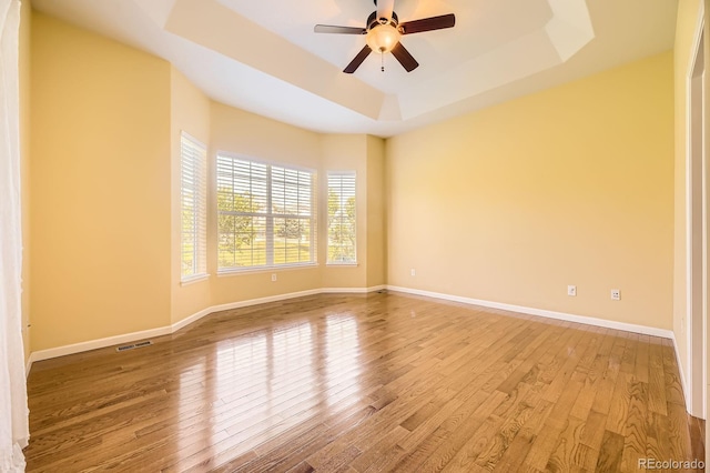 16550 Antero Cir, Broomfield, CO 80023 - empty room featuring a raised ceiling, wood finished floors, and a ceiling fan