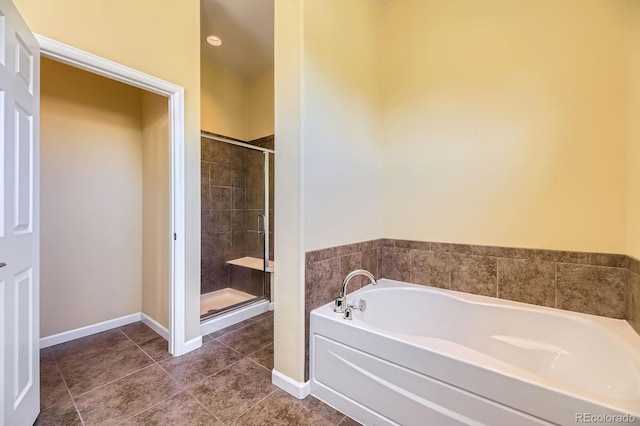 16550 Antero Cir, Broomfield, CO 80023 - full bath featuring a bath, a shower stall, and tile patterned flooring