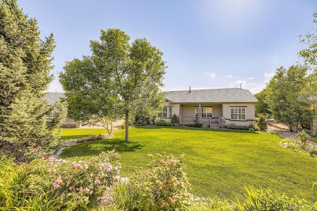 16550 Antero Cir, Broomfield, CO 80023 - rear view of house with a lawn and stucco siding