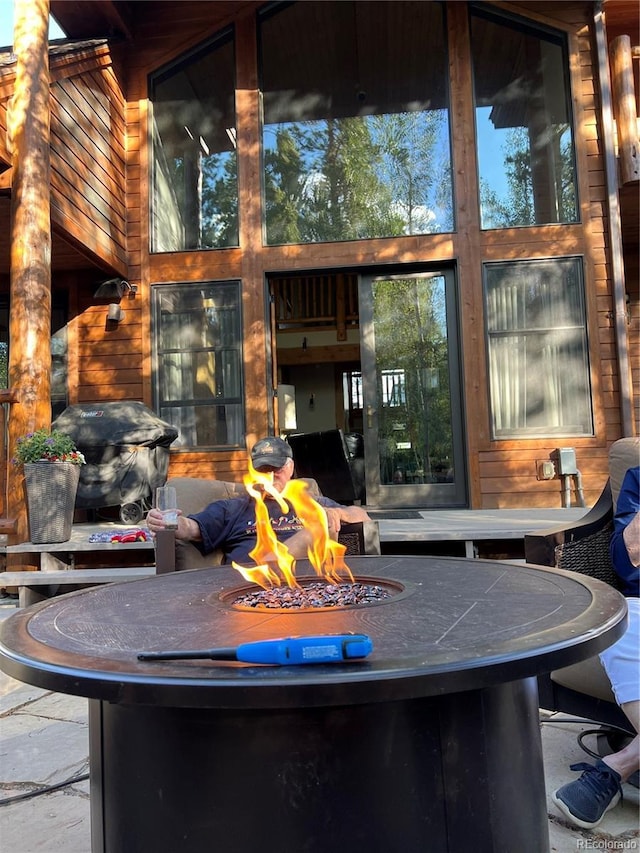 view of patio / terrace with a fire pit