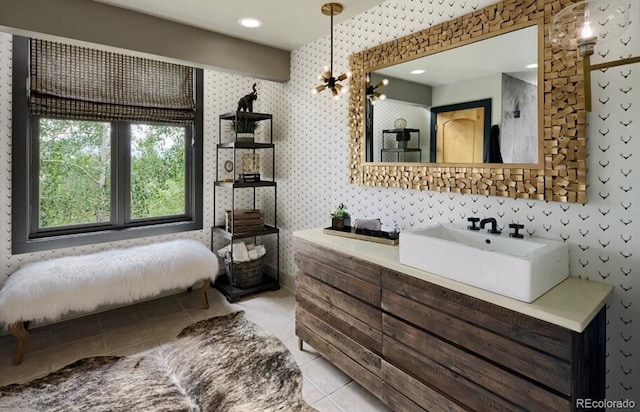 full bath featuring tile patterned flooring and a sink