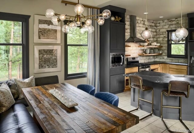 dining space with plenty of natural light and light tile patterned floors