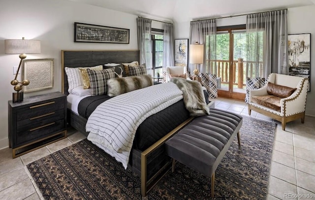 bedroom featuring light tile patterned floors and access to exterior