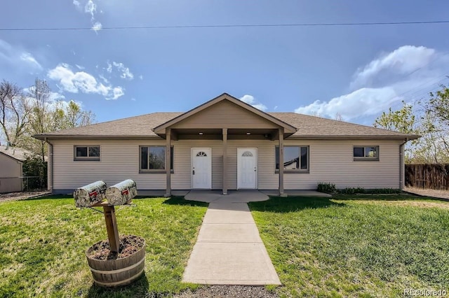 single story home with a front yard, fence, and roof with shingles