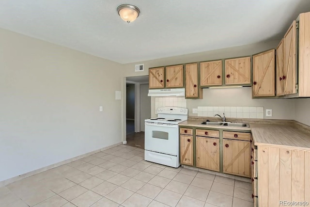 kitchen featuring under cabinet range hood, a sink, visible vents, light countertops, and white electric range oven