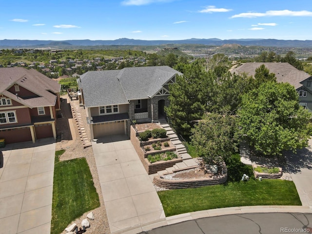1975 Wild Star Way, Castle Rock, CO 80104 - view of front of property featuring driveway, a garage, a mountain view, and a residential view