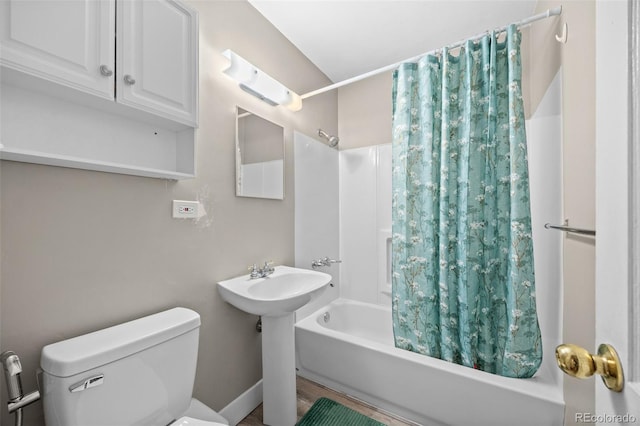 full bath with shower / tub combo and toilet