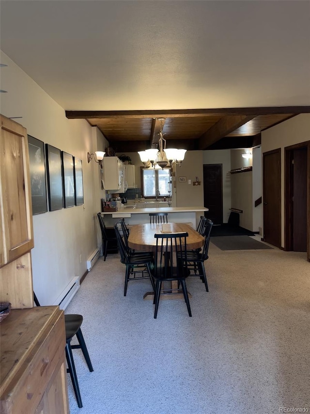 224 Creekside Dr Unit B, Frisco, CO 80443 - dining room with an inviting chandelier, a baseboard radiator, light carpet, and beamed ceiling