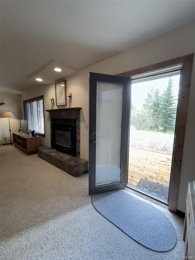 224 Creekside Dr Unit B, Frisco, CO 80443 - doorway featuring recessed lighting, a healthy amount of sunlight, carpet, and a fireplace