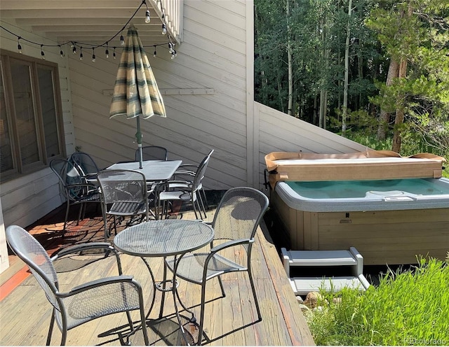 224 Creekside Dr Unit B, Frisco, CO 80443 - wooden terrace with a hot tub and outdoor dining space