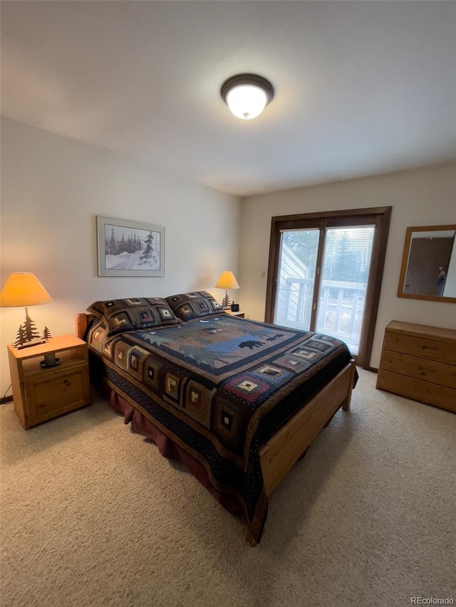 224 Creekside Dr Unit B, Frisco, CO 80443 - bedroom featuring light colored carpet and access to exterior