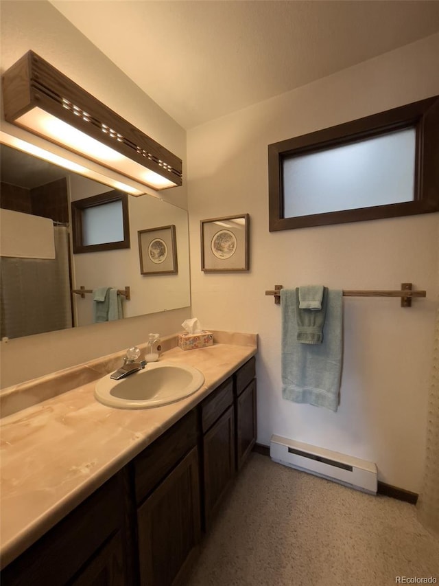 224 Creekside Dr Unit B, Frisco, CO 80443 - bathroom featuring baseboards, a baseboard heating unit, and vanity