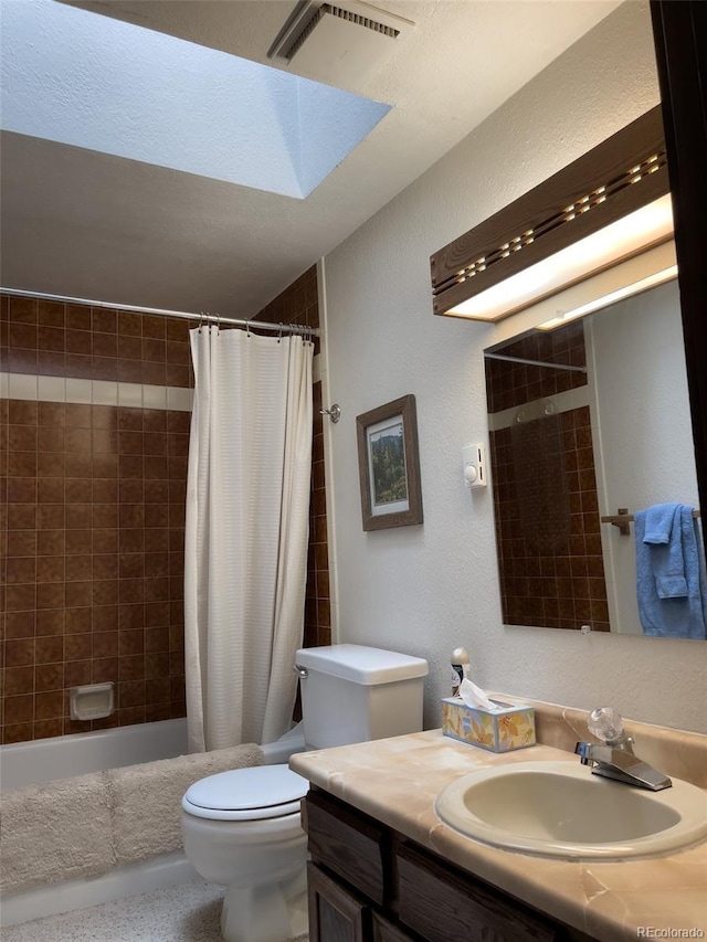 224 Creekside Dr Unit B, Frisco, CO 80443 - full bath featuring vanity, visible vents, a textured wall, toilet, and a skylight
