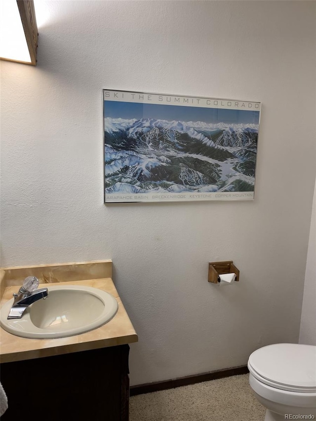 224 Creekside Dr Unit B, Frisco, CO 80443 - half bath featuring toilet, baseboards, and vanity