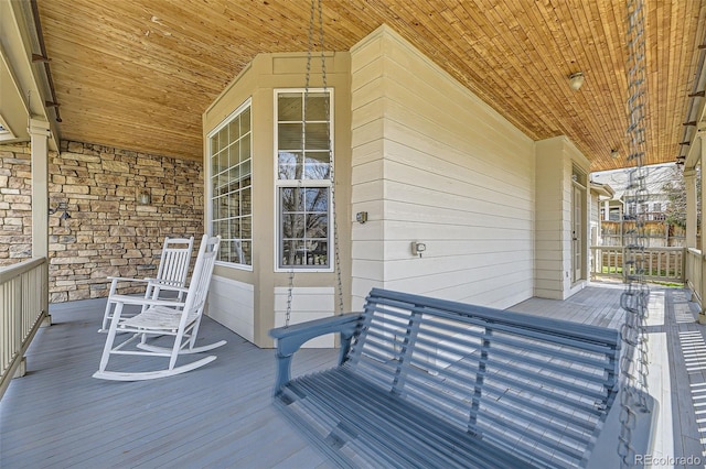 wooden terrace featuring a porch