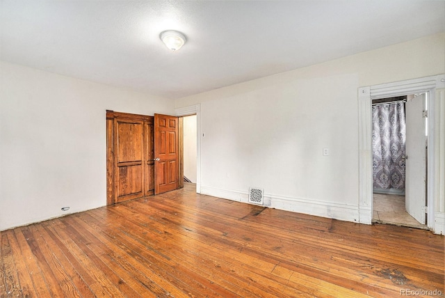 7 Elati St, Denver, CO 80223 - unfurnished bedroom with hardwood / wood-style flooring