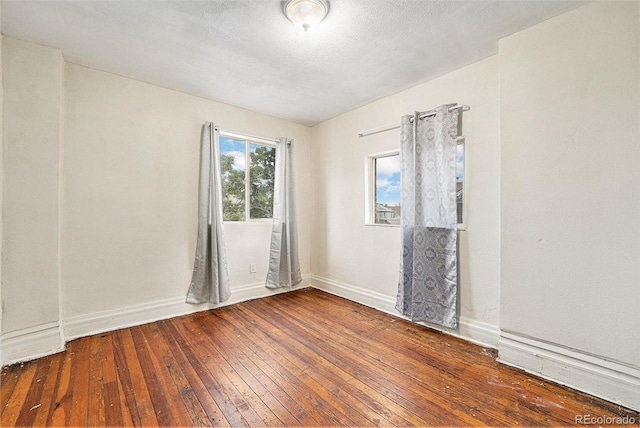 7 Elati St, Denver, CO 80223 - empty room with hardwood / wood-style floors and baseboards