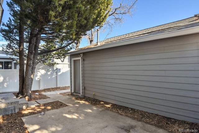 view of side of property featuring a patio