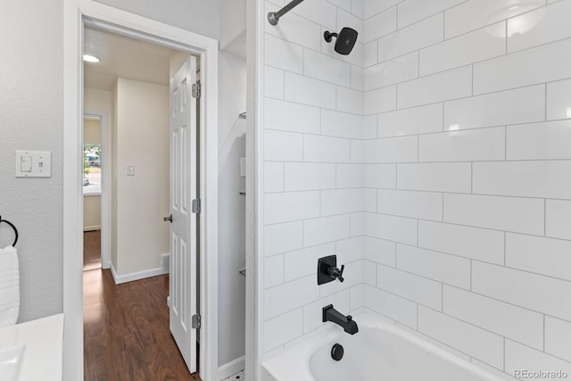 250 W Midway Blvd, Broomfield, CO 80020 - bathroom with wood finished floors and tub / shower combination