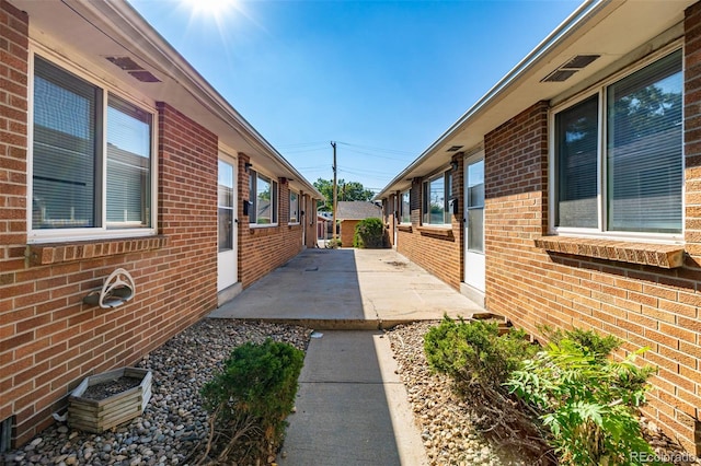 view of side of property featuring a patio