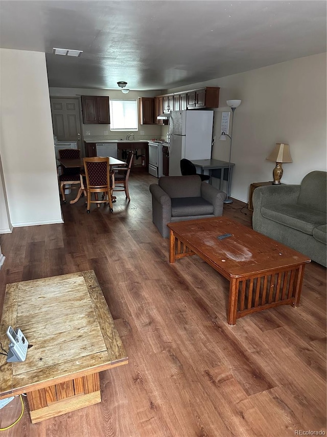 living room with dark wood-type flooring