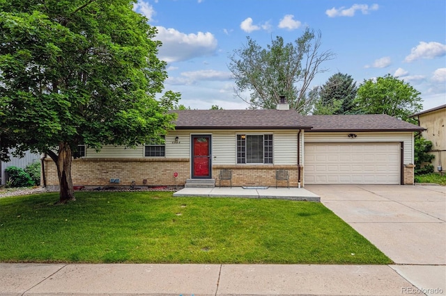 6508 S Garland Way, Littleton, CO 80123 - ranch-style home featuring brick siding, an attached garage, concrete driveway, a front yard, and a chimney