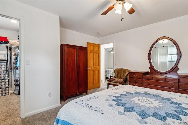 6508 S Garland Way, Littleton, CO 80123 - bedroom featuring carpet, ceiling fan, a spacious closet, and a closet