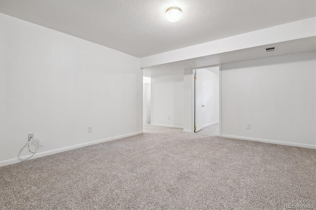 6508 S Garland Way, Littleton, CO 80123 - finished basement featuring carpet floors and a textured ceiling