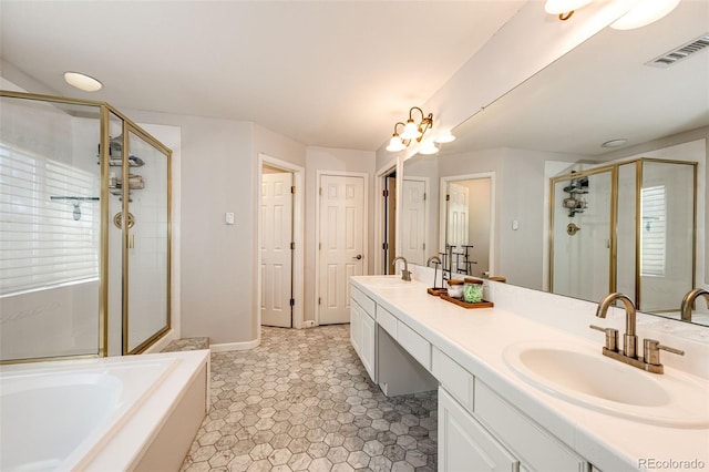4970 Laurelglen Ln, Highlands Ranch, CO 80130 - full bath featuring double vanity, a shower stall, a garden tub, tile patterned flooring, and baseboards