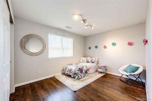 4970 Laurelglen Ln, Highlands Ranch, CO 80130 - bedroom with baseboards, wood finished floors, and a chandelier