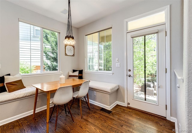 4970 Laurelglen Ln, Highlands Ranch, CO 80130 - dining space featuring dark wood finished floors and baseboards
