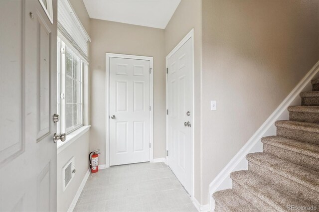 3262 E 103rd Dr Unit 1806, Thornton, CO 80229 - foyer featuring stairway and baseboards