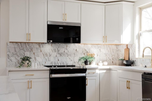 kitchen featuring plenty of natural light, range with electric cooktop, and white cabinets