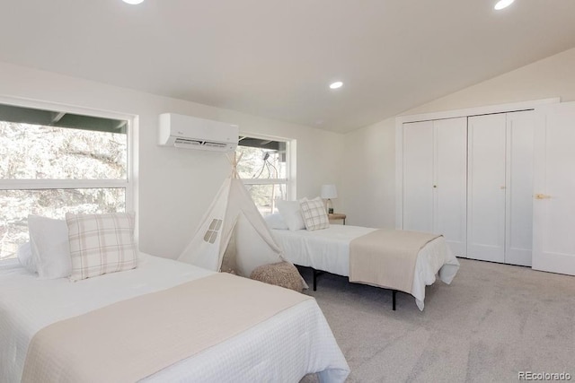 bedroom featuring lofted ceiling, a wall unit AC, recessed lighting, light colored carpet, and a closet