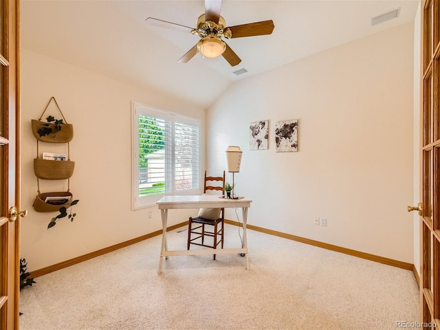 carpeted office space featuring ceiling fan and lofted ceiling