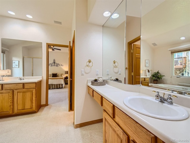 bathroom featuring plus walk in shower, vanity, and ceiling fan