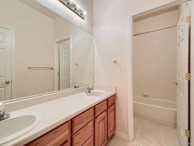 bathroom with shower / bathing tub combination and vanity