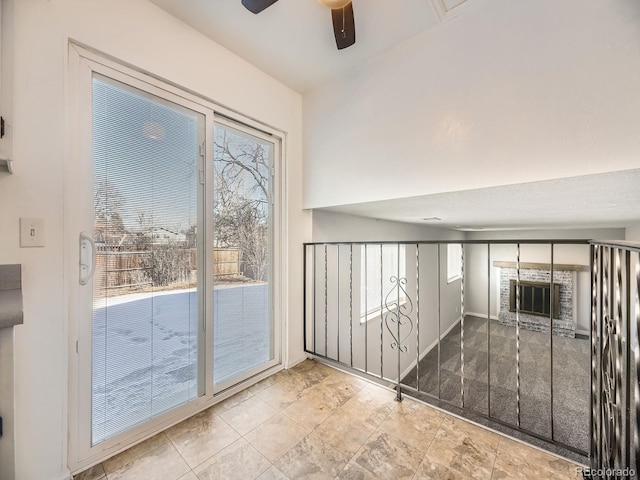 doorway to outside with ceiling fan and a healthy amount of sunlight